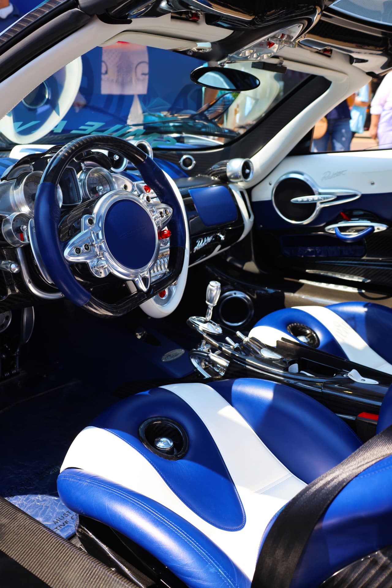 Pagani Huayra cockpit with blue and white leather sport seats and carbon details