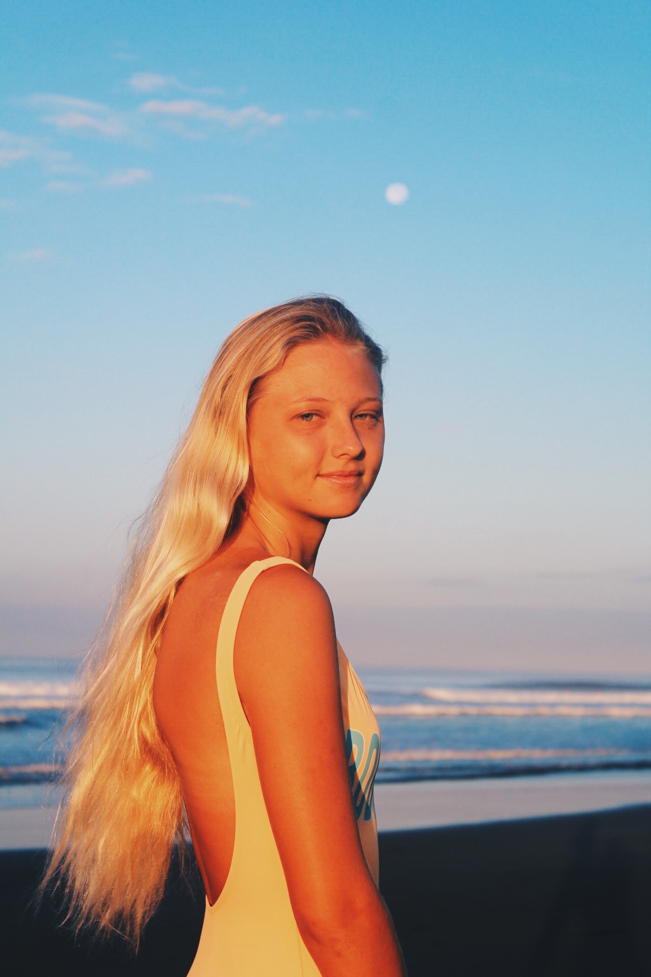 Golden hour beach portrait at sunset