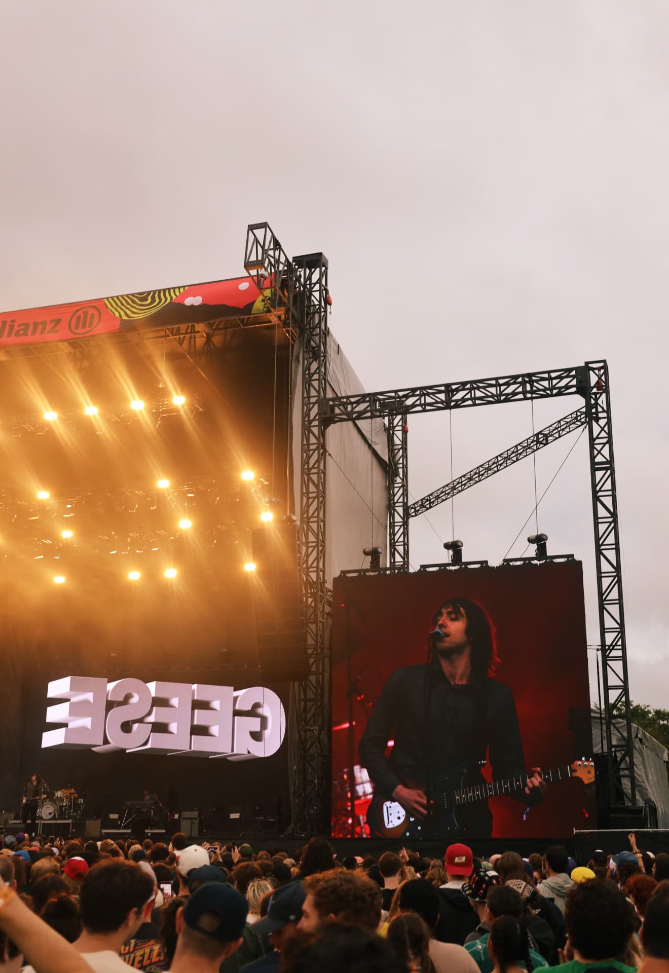 Geese performing on the main stage with a large screen and warm golden lighting