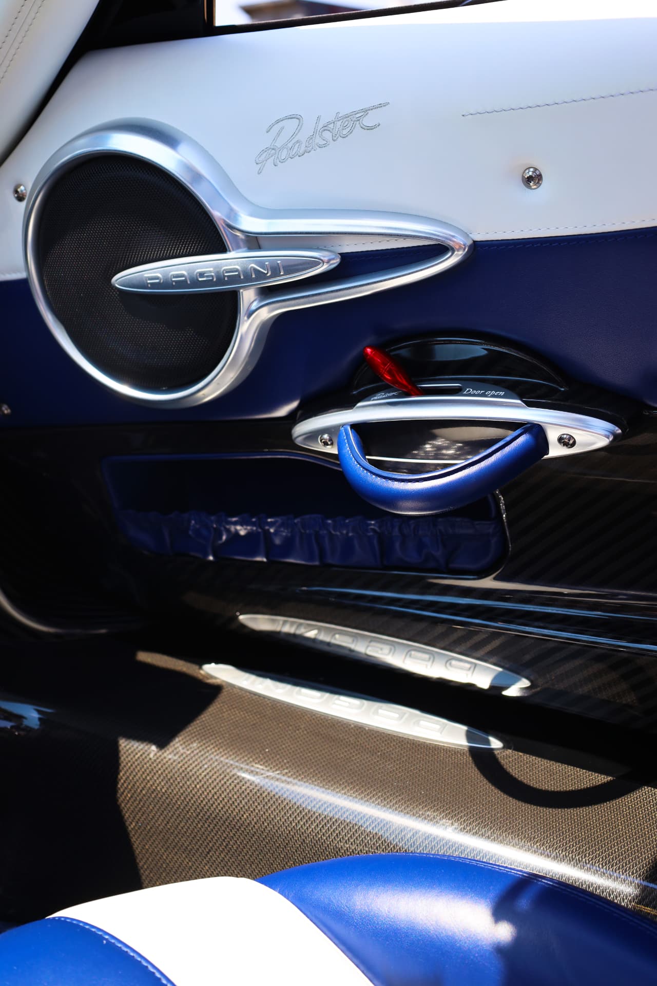 Pagani Huayra Roadster door panel with chrome speaker grille and leather handle detail