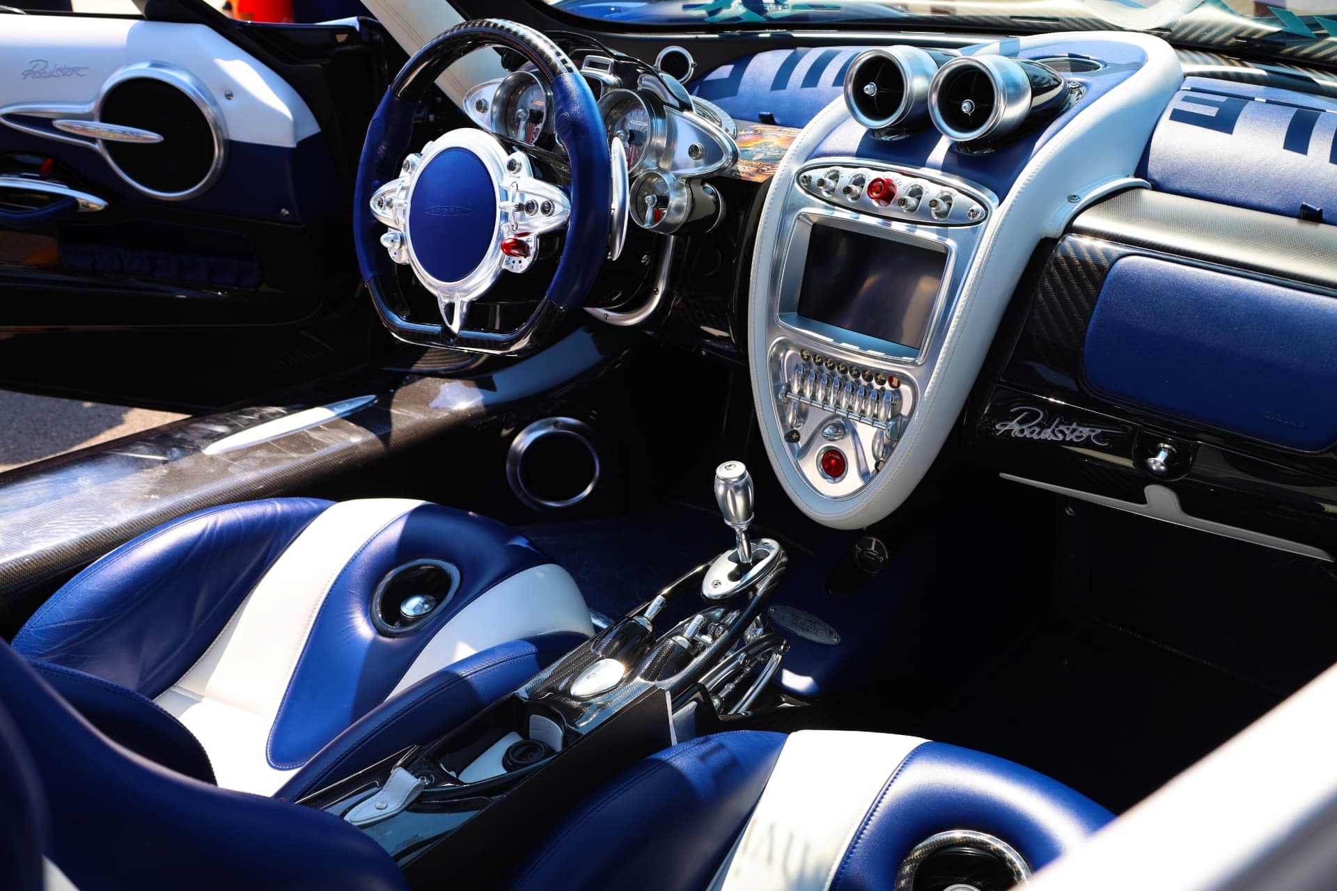 Pagani Huayra Roadster interior with blue leather and exposed shifter mechanism